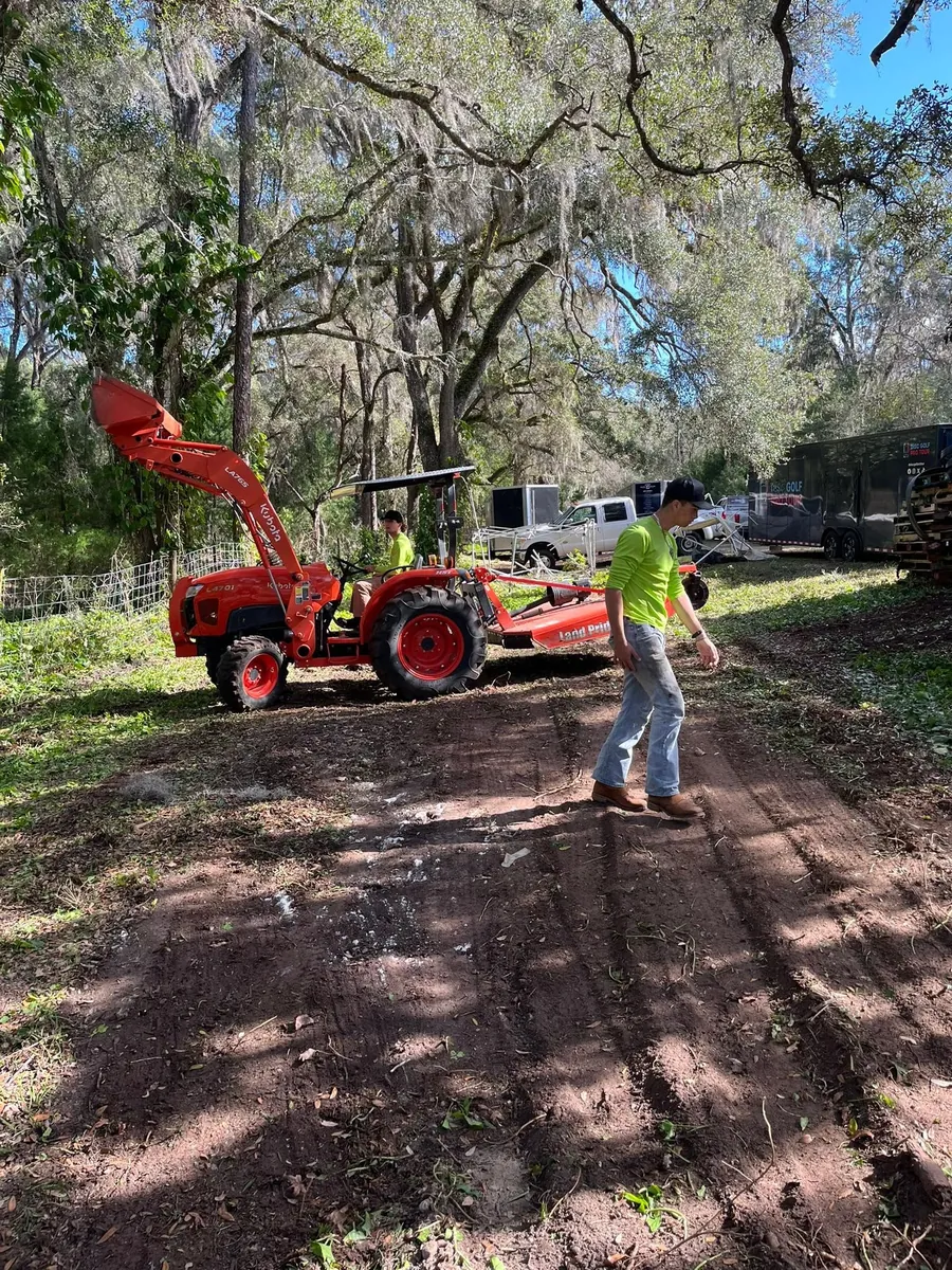 Kubota tractor handling land clearing